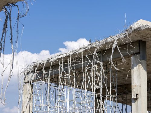 Detail of the demolition of an urban bridge Barcelona where you see the road cut.